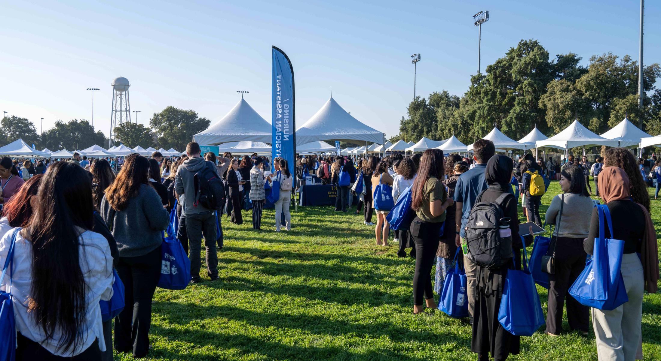 Attendees in line to meet with exhibitors during Pre-Health Fair