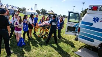 EMT and ambulance with attendees