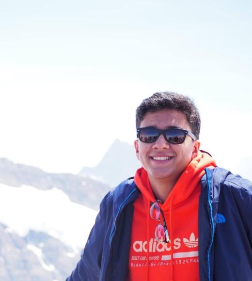 Jaskaran is smiling with glasses on and a Mountain View background.